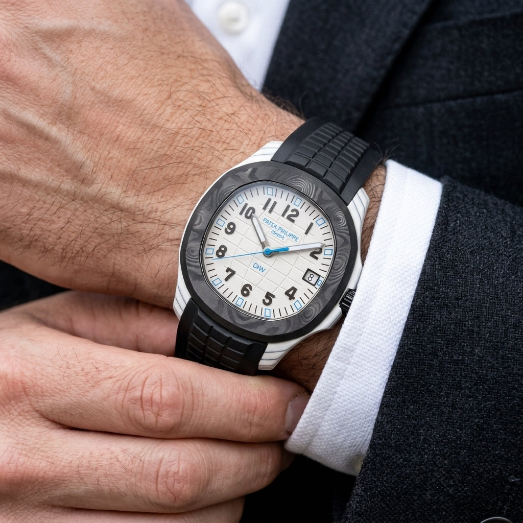 White carbon grid-dial watch with a black bezel and blue accents on the wrist as a shirt cuff is fastened