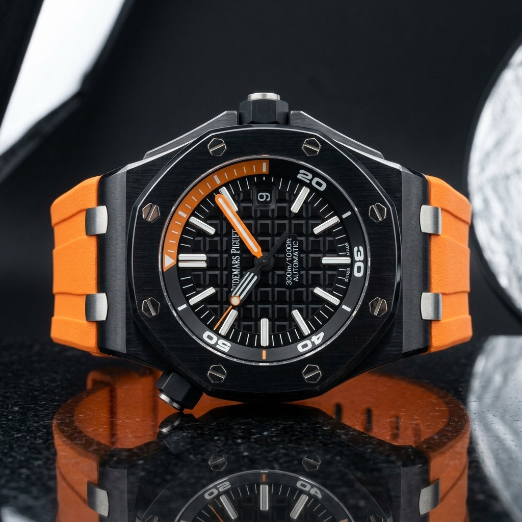 Black ceramic diver on an orange rubber strap worn under a navy suit cuff