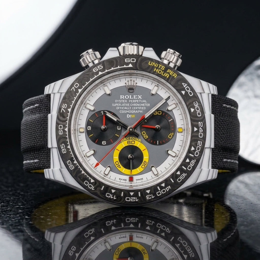 White CarboQuartz chronograph on a black woven strap, worn under a cuff