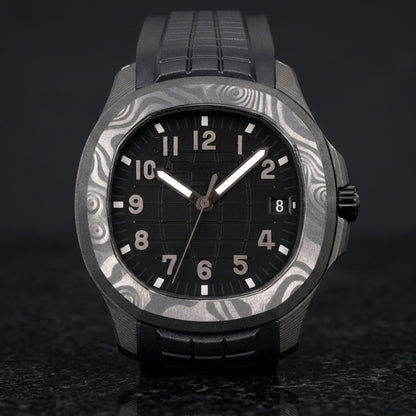 Forged-carbon watch with a black grid dial and gunmetal-grey numerals, upright on polished black granite