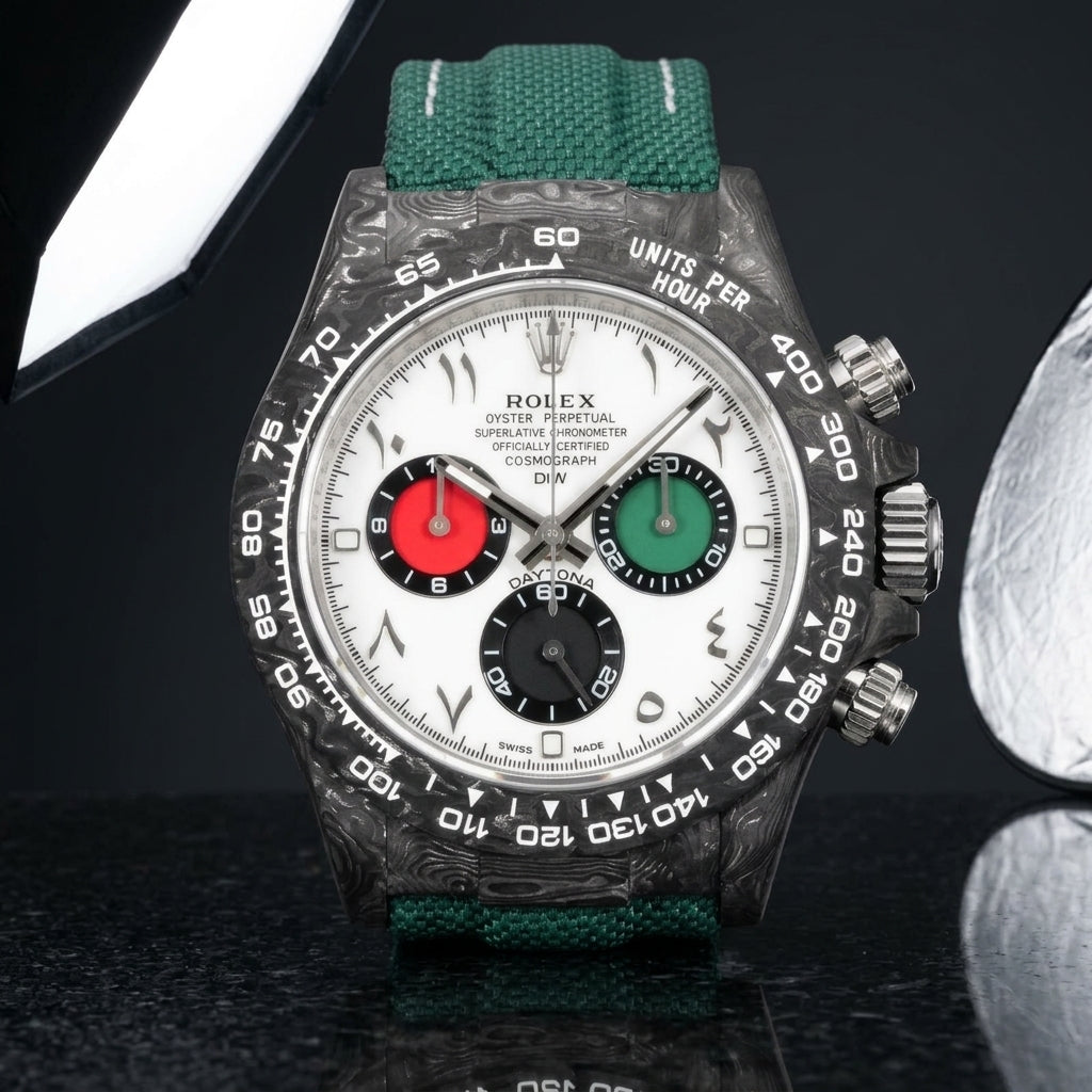 Forged-carbon chronograph with a white dial and Arabic numerals on pale stone