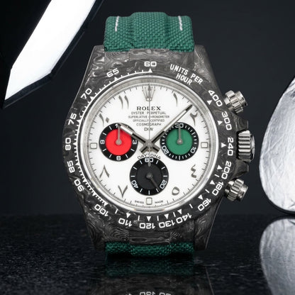 Forged-carbon chronograph with a white dial and Arabic numerals on pale stone