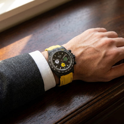 The Yellow Racing worn on the wrist beneath a tailored shirt cuff