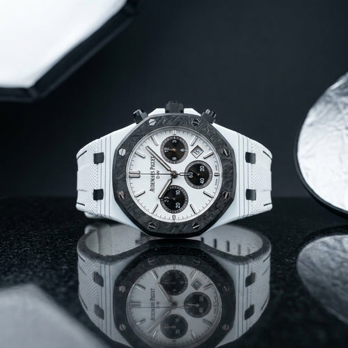 Studio photograph of the White Ceramic Sports on black granite