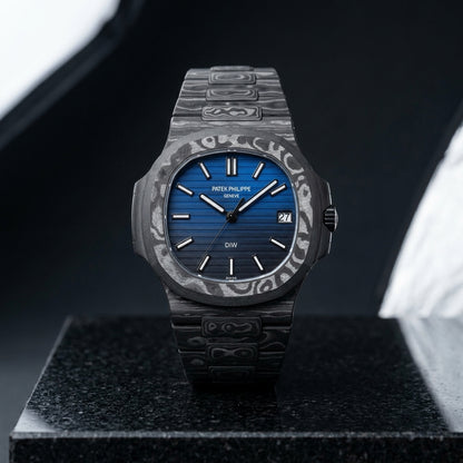 Carbon sports watch worn under a suit cuff