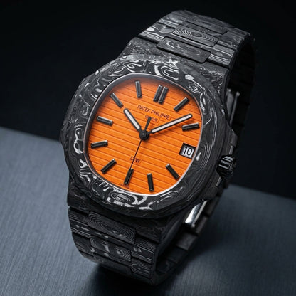 Black and silver-white marbled carbon sports watch at a three-quarter angle on dark slate, its orange dial catching the light