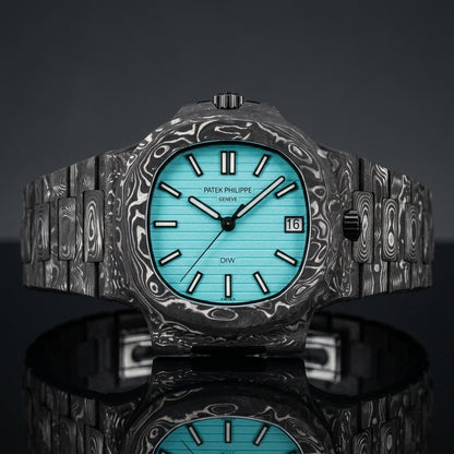 Carbon sports watch with a turquoise dial on black granite