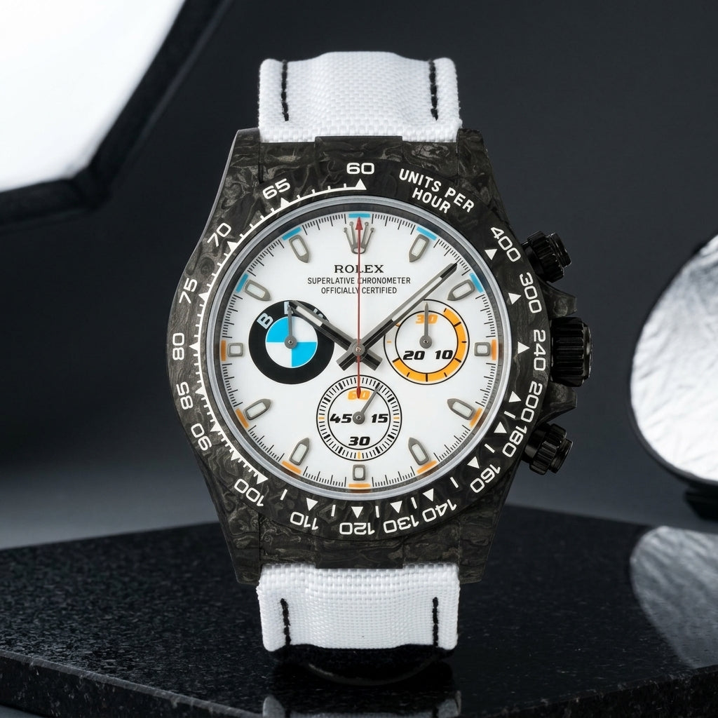 Black forged-carbon chronograph with a white dial on black granite