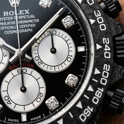 Macro of the glossy black dial, its three silver counters and the clear moissanite markers in square settings