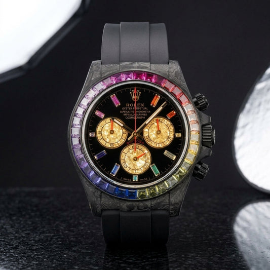 Forged carbon chronograph with full rainbow bezel and gold leaf counters on black granite