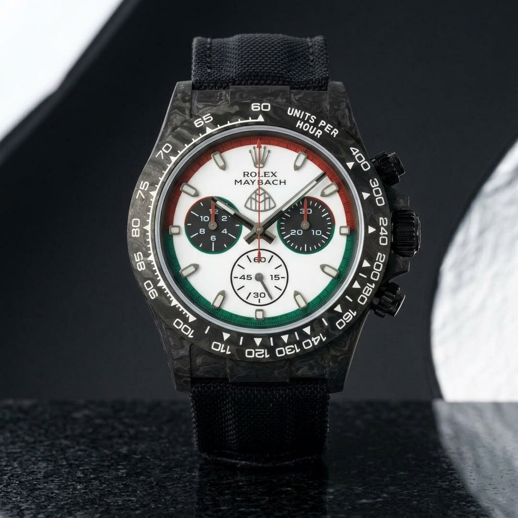 Black forged-carbon chronograph with a red and green ringed dial on black granite