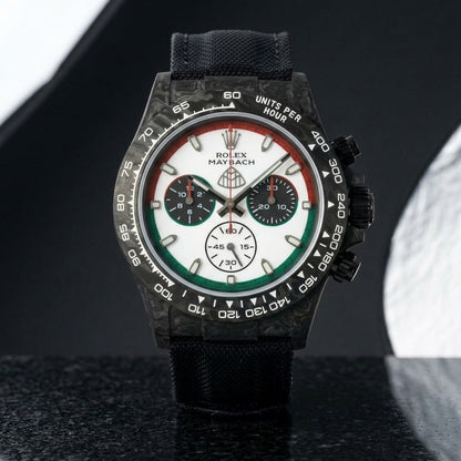 Black forged-carbon chronograph with a red and green ringed dial on black granite