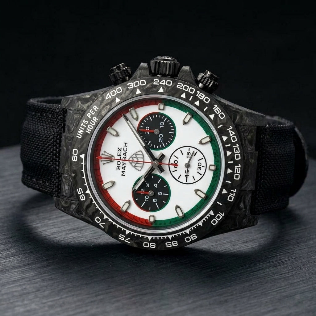 Black forged-carbon chronograph at a three-quarter angle on dark slate