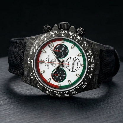 Black forged-carbon chronograph at a three-quarter angle on dark slate