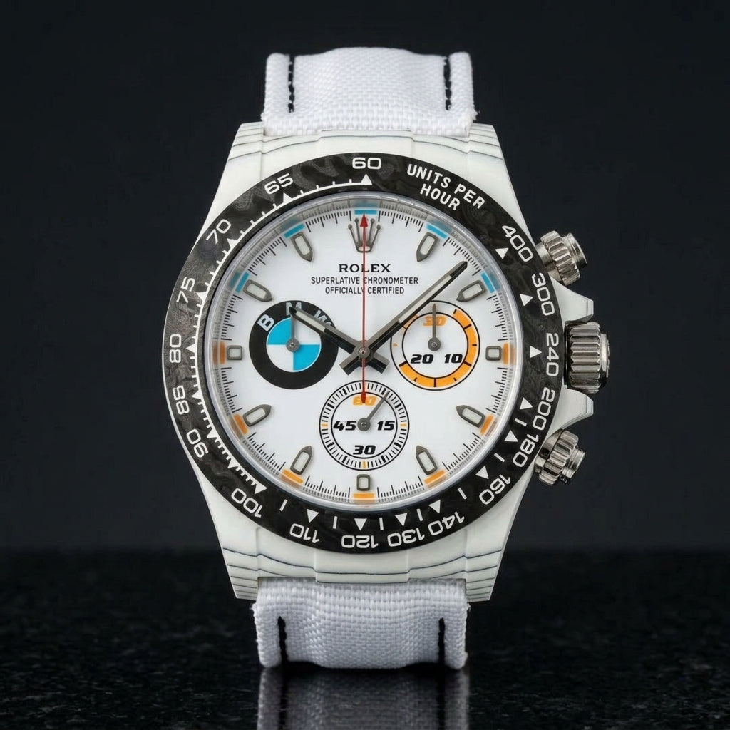 White forged-carbon chronograph with a white dial on black granite