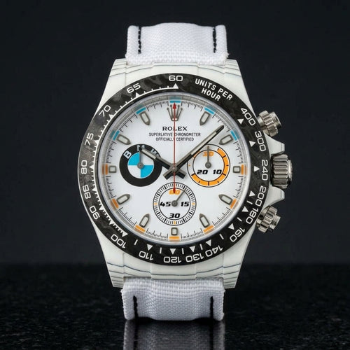 White forged-carbon chronograph with a white dial on black granite