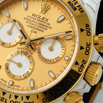 Macro of the champagne dial, its three white counters and gold-framed markers
