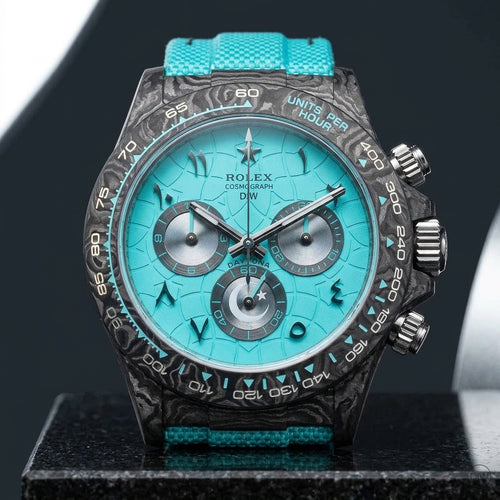 Forged-carbon chronograph with a turquoise crackle dial on black granite