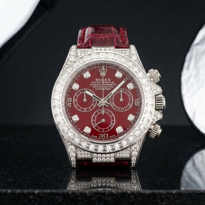 White gold chronograph and bracelet upright on polished black granite