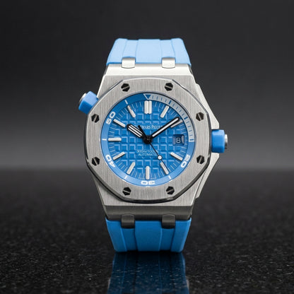Steel diver on a blue rubber strap worn under a navy suit cuff