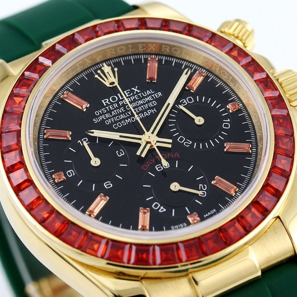 Macro of the black dial with orange stone markers and three black counters inside the bezel of red baguette-cut stones