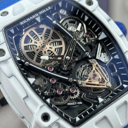 Macro of the open skeleton dial: the rose-gold spoked wheel at the upper left, pink jewels and the tourbillon cage at six under a rose-gold bridge