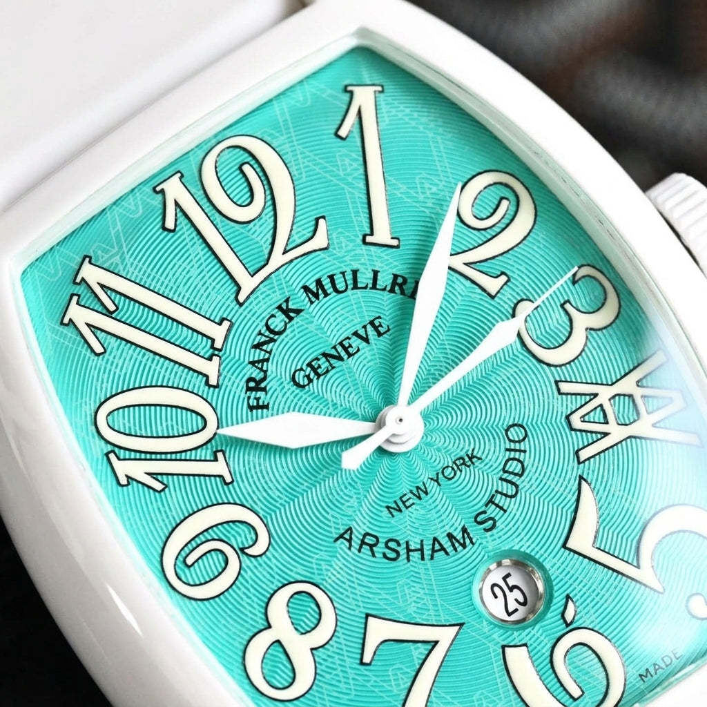 Macro of the turquoise guilloché dial with large cream-white numerals, the angular 4 and the round date window above the 6