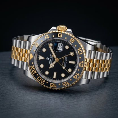 Two-tone GMT at a three-quarter angle on dark slate