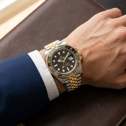 Two-tone GMT worn under a navy suit cuff