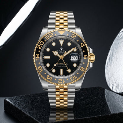 Two-tone GMT worn under a navy suit cuff