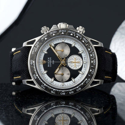 Forged carbon chronograph with hollow lugs and gold hands on black granite