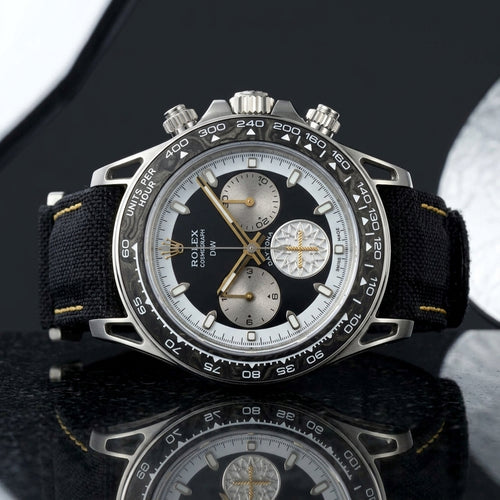 Forged carbon chronograph with hollow lugs and gold hands on black granite