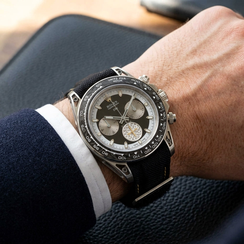 Forged carbon chronograph worn under a navy suit cuff