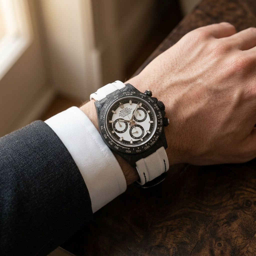 The Forged Carbon Automatic worn on the wrist beneath a tailored shirt cuff