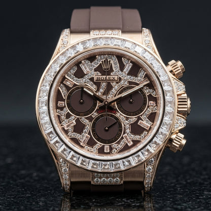 Rose gold chronograph with a brown leopard dial on a brown rubber strap, on the wrist below a dark suit cuff