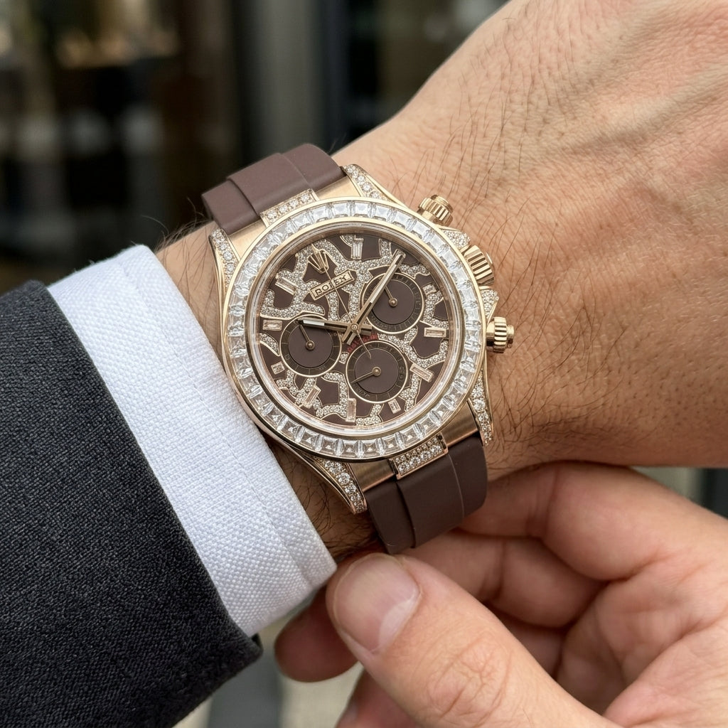 Rose gold chronograph with a baguette bezel on the wrist as a shirt cuff is fastened