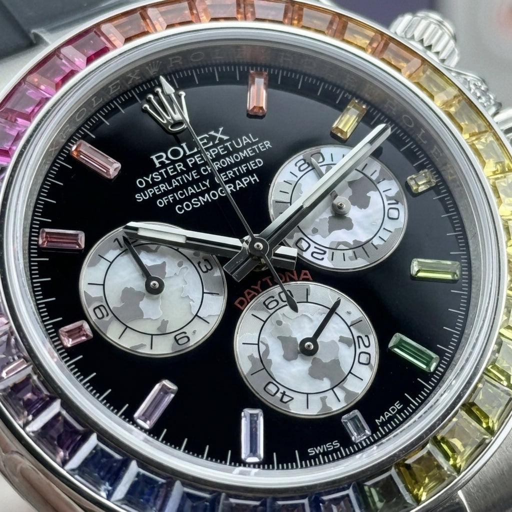 Macro of the black dial with coloured baguette hour markers and three pearl-white camouflage counters