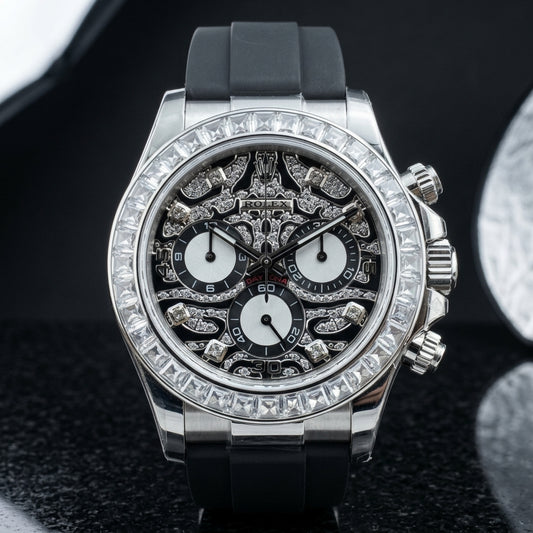 Steel chronograph with a black leopard pavé dial and a clear baguette bezel, upright on polished black marble