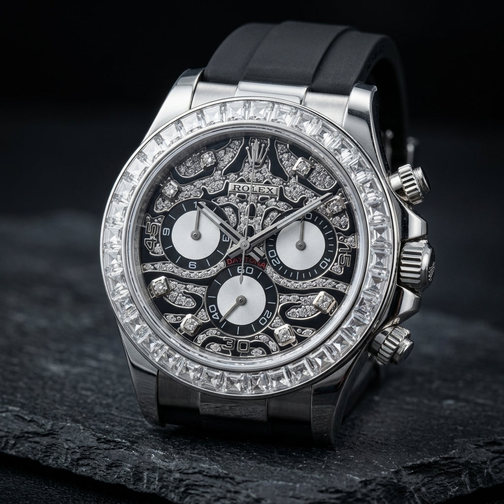 Steel chronograph at a three-quarter angle, the fluted crown and pushers beside the baguette bezel