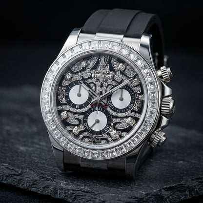 Steel chronograph at a three-quarter angle, the fluted crown and pushers beside the baguette bezel