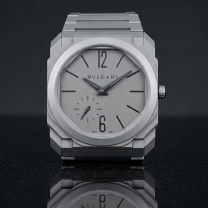 Sandblasted titanium octagonal watch and integrated bracelet on black granite
