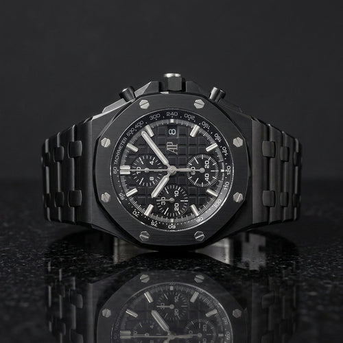 All-black ceramic octagonal chronograph watch on black granite