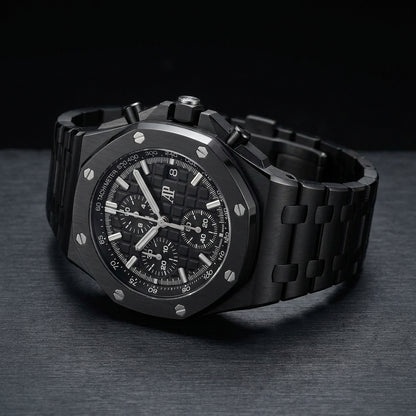 Black ceramic Offshore chronograph at a three-quarter angle on dark slate