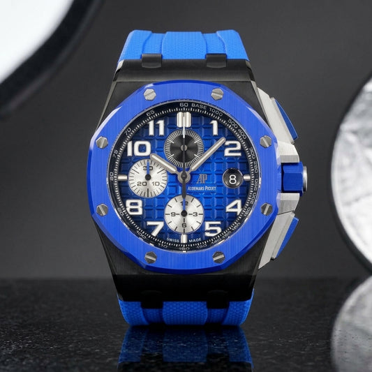 Blue ceramic octagonal chronograph watch on black granite