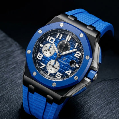 Blue and black ceramic Offshore chronograph at a three-quarter angle on dark slate