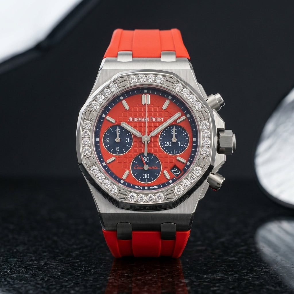 Red dial diamond bezel chronograph worn on the wrist