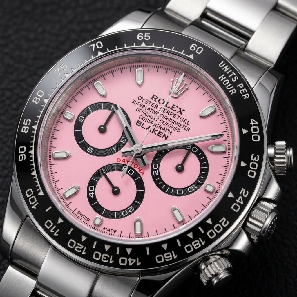 Macro of the pink lacquer dial, black counters and ceramic tachymeter bezel