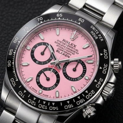 Macro of the pink lacquer dial, black counters and ceramic tachymeter bezel