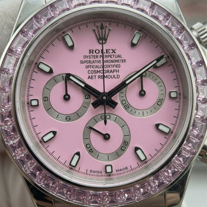 Macro of the pink dial, silver counters and square-cut pink stone bezel