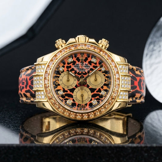 Yellow gold chronograph with leopard print dial and champagne stone bezel on black granite
